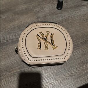 Chic Beige Women's Cosmetic Bag with Gold Detailing